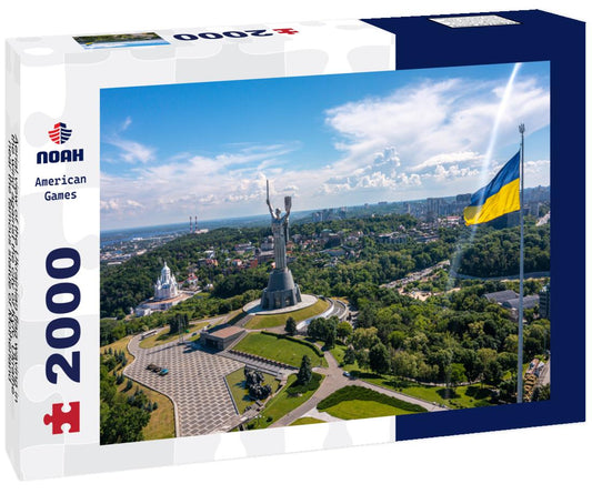 Noah Jigsaw Puzzle Aerial view of the Ukrainian flag waving in the wind against the city of Kyiv, Ukraine near the famous statue of Motherland 2000 pieces