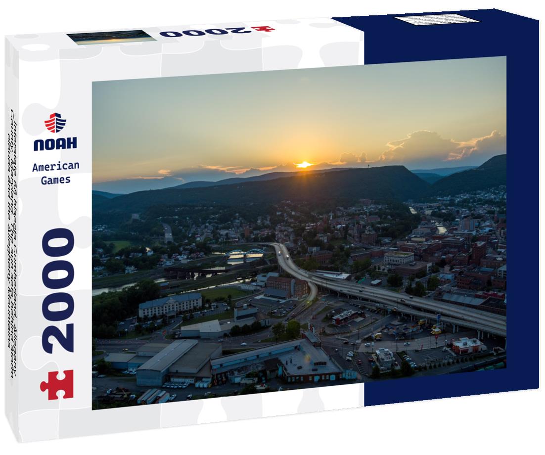 Noah Jigsaw Puzzle Interstate 68 bisects Cumberland, Allegany County, Maryland. The sun sets behind storm clouds and the Allegheny Mountains 2000 pieces