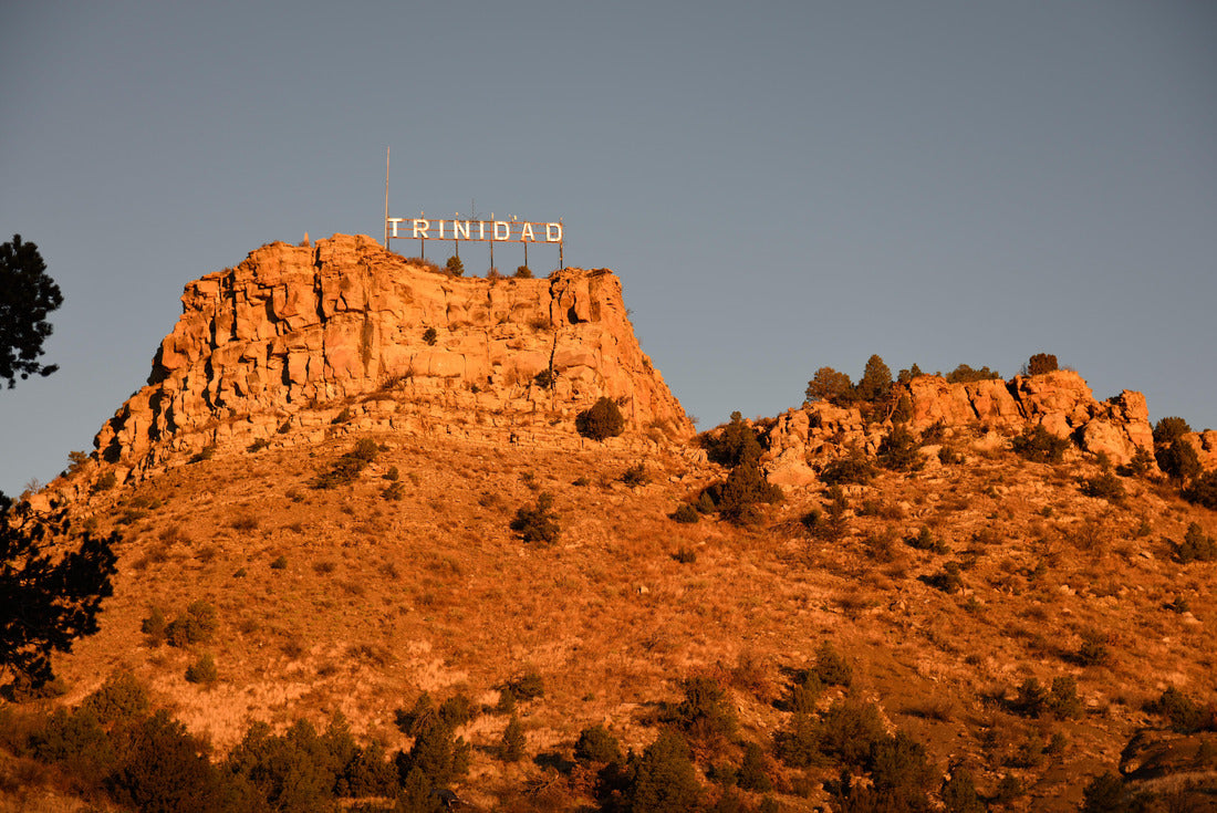 Low angle view of the city of Trinidad Colorado landmark sign with an early sunrise glow against the rocky butte and sky 2000pc Puzzle