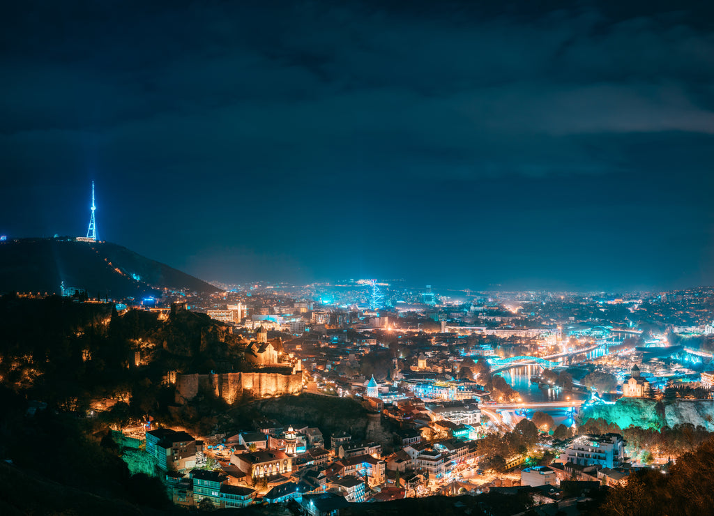 Tbilisi, Georgia. Top View Of Cityscape Skyline City In Night Illuminations. Georgian Capital