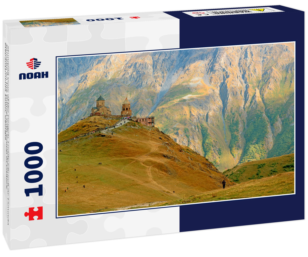 Stunning View of the Gergeti Trinity Church or Tsminda Sameba on the Hilltop with Group of Visitors, Stepantsminda Town, Georgia