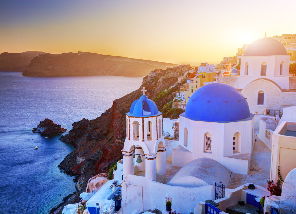 Oia town on Santorini island, Greece at sunset. Aegean sea
