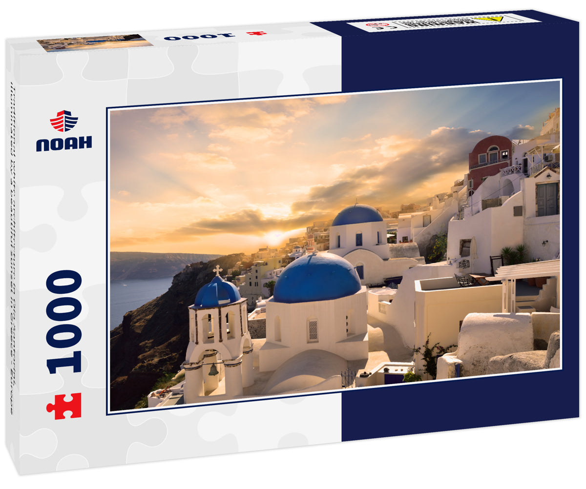 Traditional white architecture in Oia Santorini, illuminated by a beautiful sunset in Greece - Europe