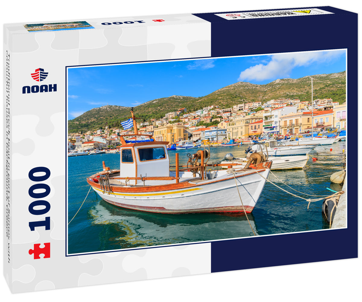 Traditional Greek boat in port of Samos with colourful houses in background, Greece