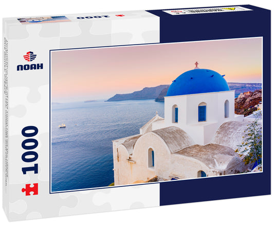 Picturesque view of Old Town Oia on the island Santorini, white houses, windmills and church with blue domes, Greece