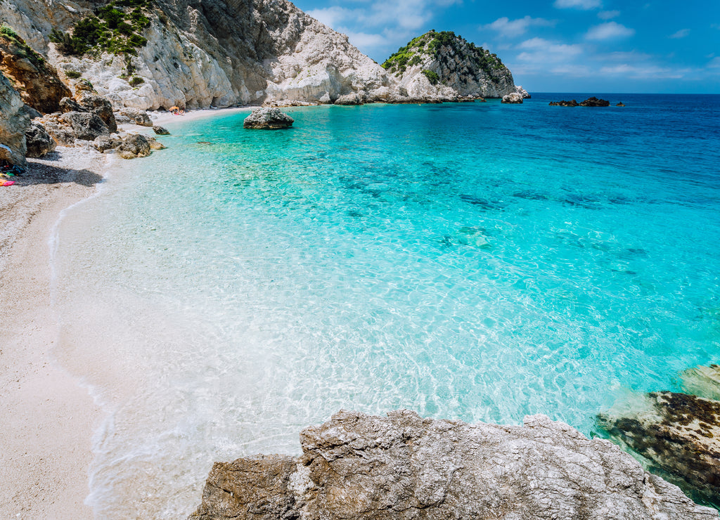 Agia Eleni beach in Kefalonia Island, Greece. Most beautiful rocky wild beaches with clear emerald water and high white cliffs