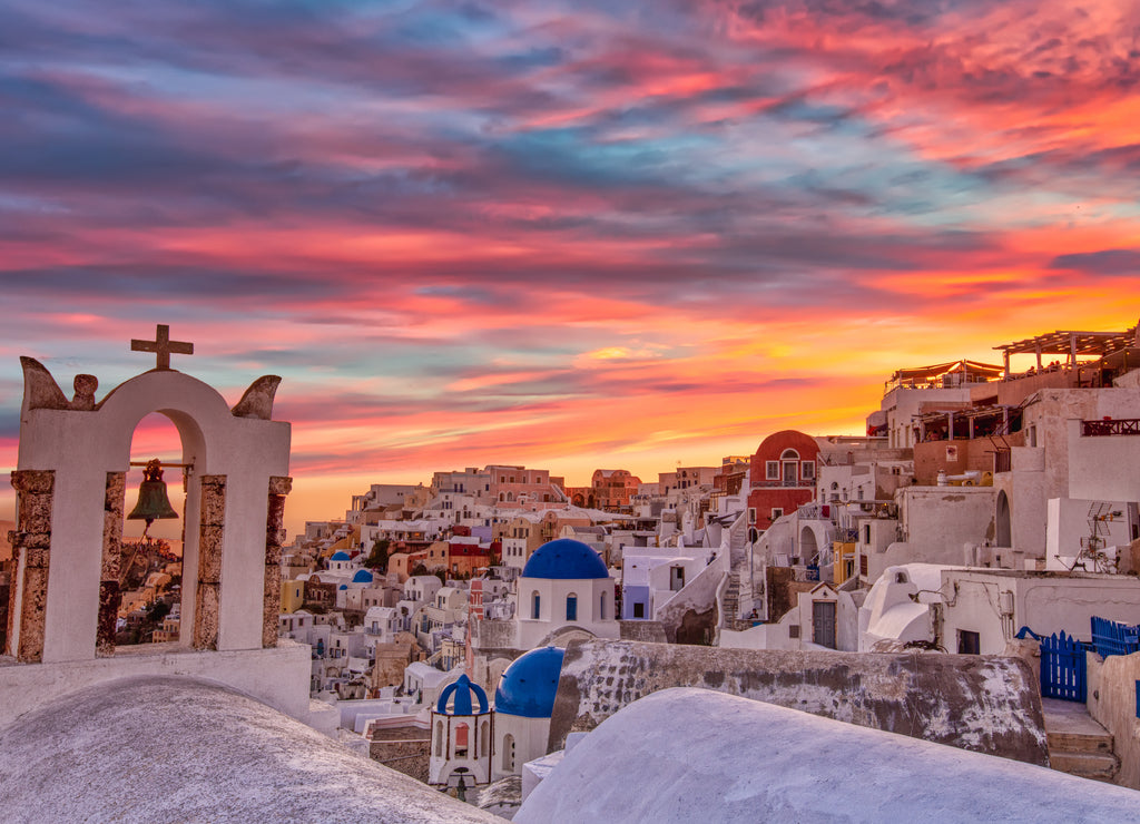 Oia village in Santorini island at sunset in Greece