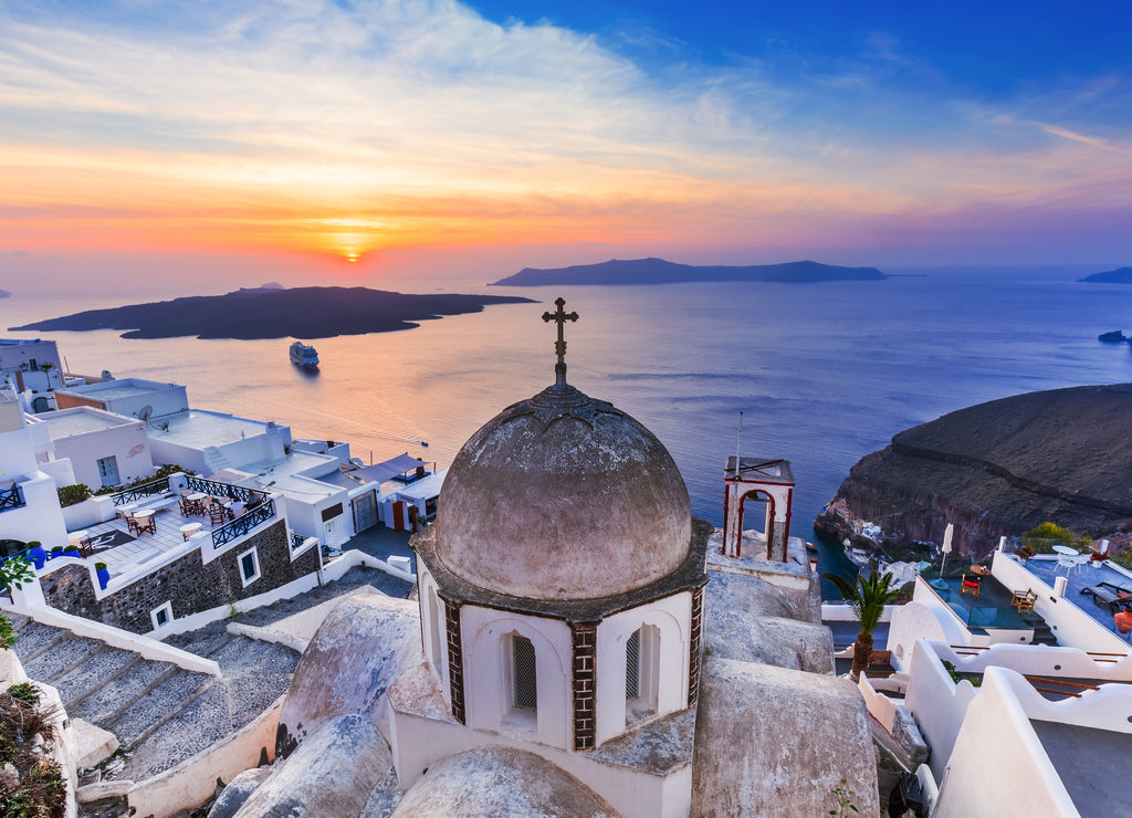 Santorini, Greece. The picturesque Fira village at sunset