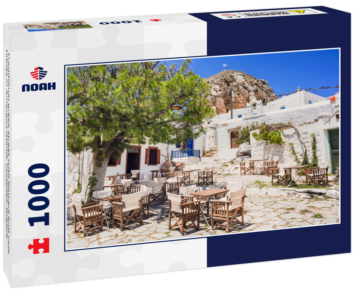 Traditional greek street with flowers and cafe tables in Amorgos island, Cyclades, Greece