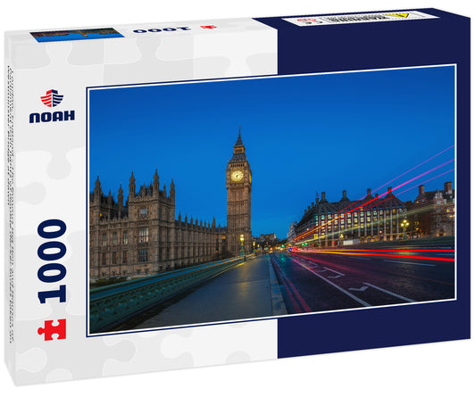 London, England - The famous Big Ben and Houses of Parliament with lights of double decker buses taken on Westminster Bridge at dawn