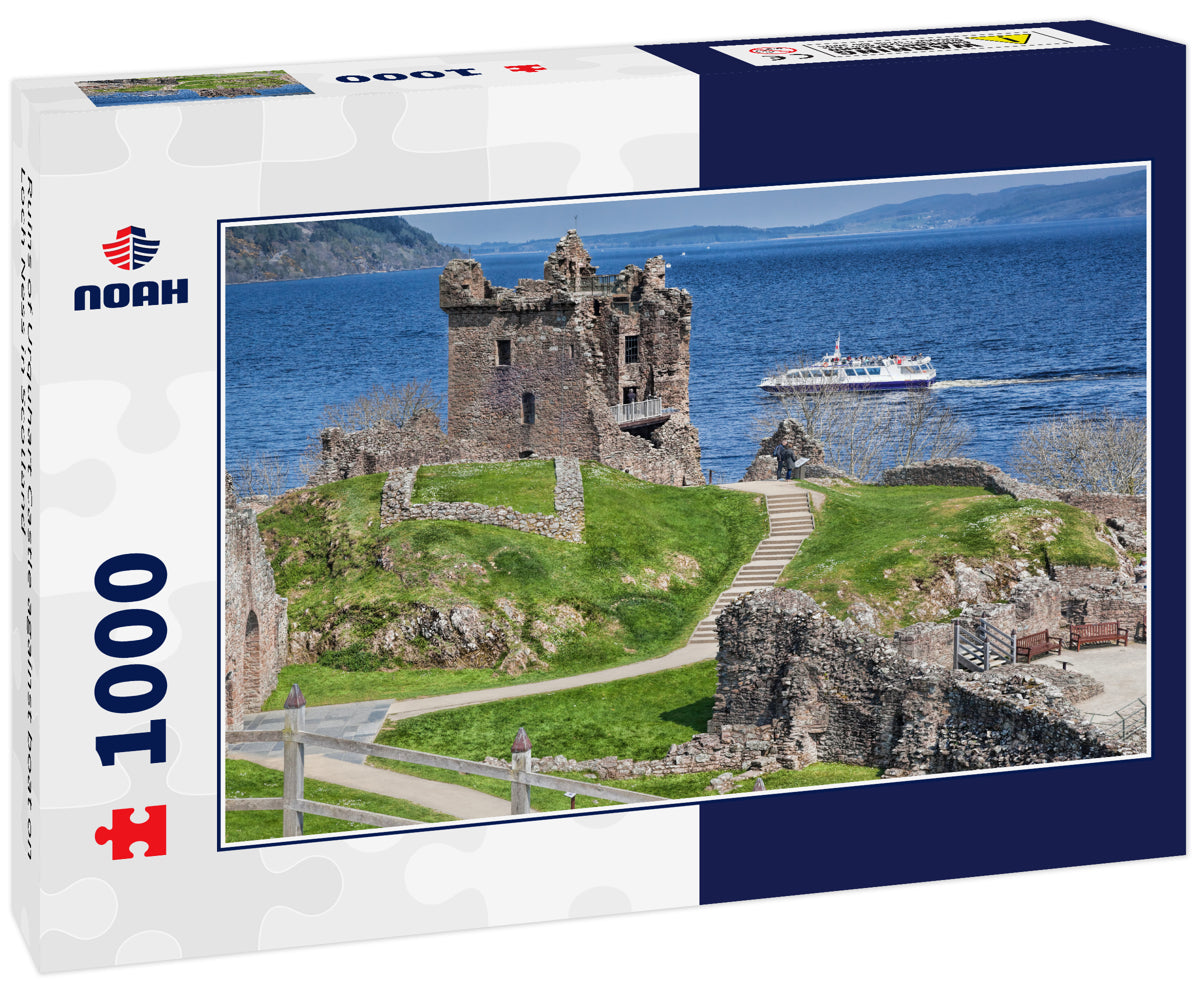 Ruins of Urquhart Castle against boat on Loch Ness in Scotland