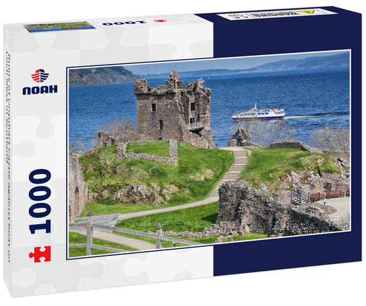 Ruins of Urquhart Castle against boat on Loch Ness in Scotland