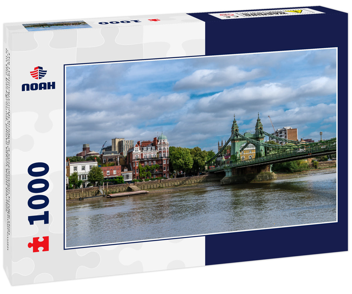 The Hammersmith Bridge, a suspension bridge that crosses the River Thames in west London. Hammersmith is in the background, photo taken from Barnes