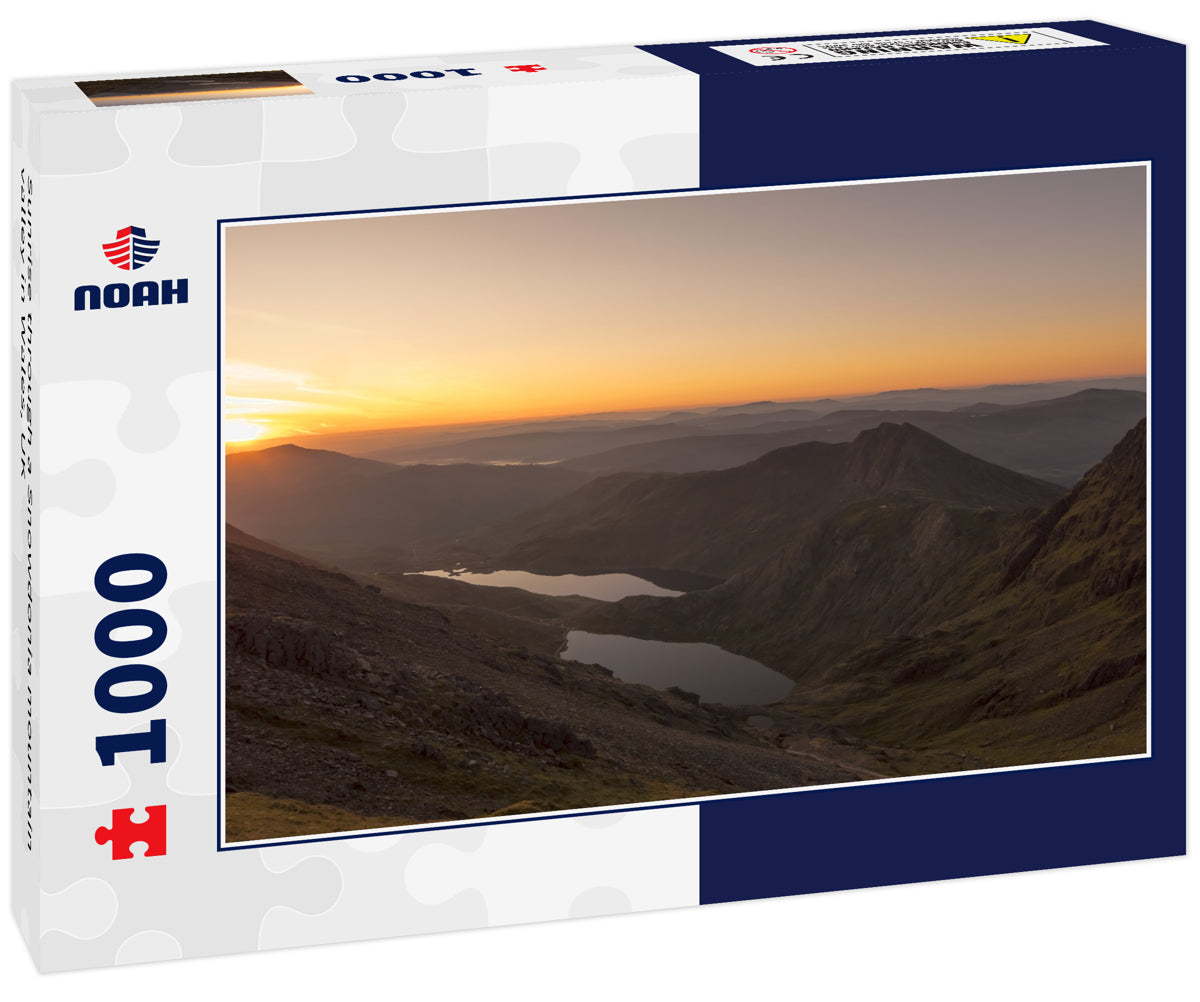 Sunrise through a Snowdonia mountain valley in Wales, UK