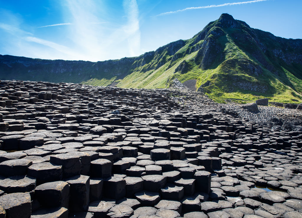 Landscape of Giant's Causeway trail with a blue sky in summer in Northern Ireland, County Antrim. UNESCO heritage