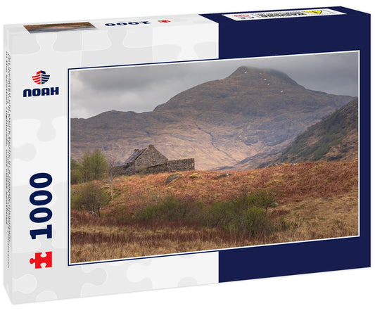 An isolated old stone bothy in a moody mountain landscape on the remote and rugged Knoydart peninsula in the Scottish Highlands, west coast Scotland