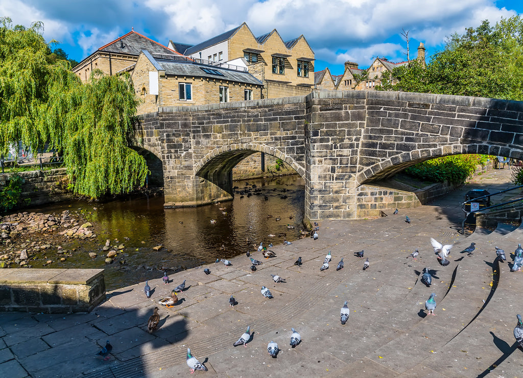 A view towards the original bridge in Hebden Bridge, Yorkshire, UK in summertime
