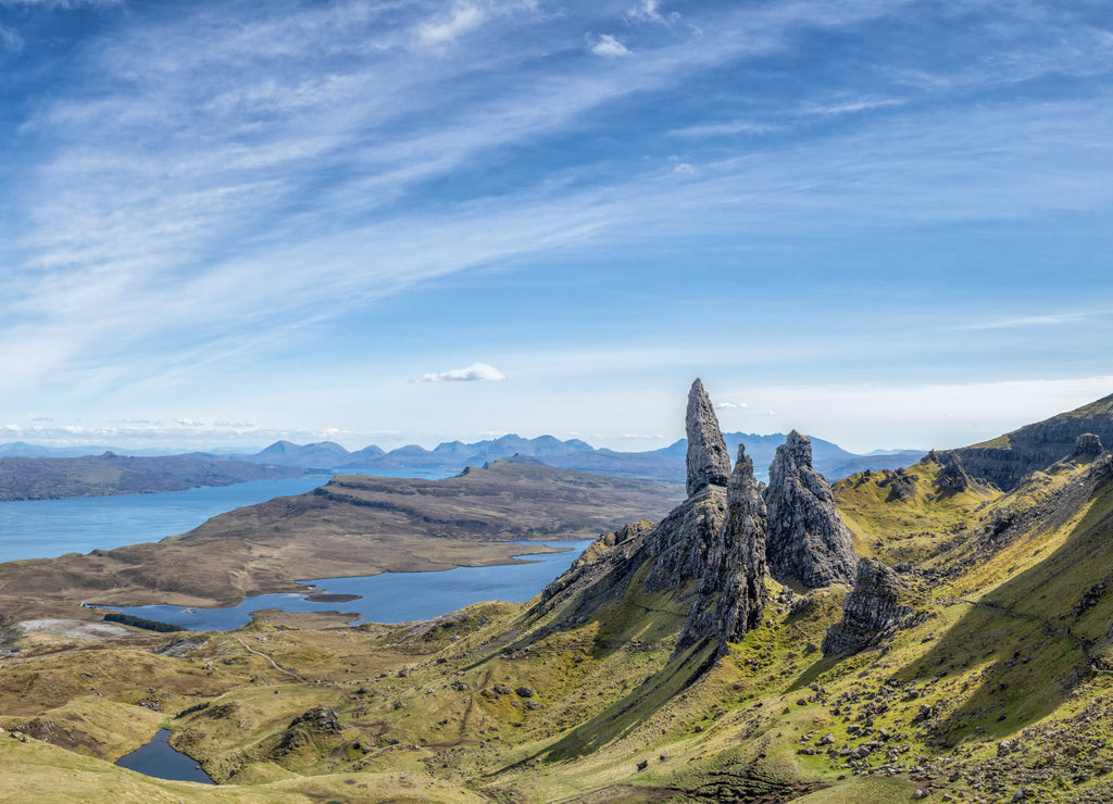 Dramatic Scottish Highlands, blue sky at the Old Man of Storr, tourist attraction on the Isle of Skye. Hebrides in the United Kingdom