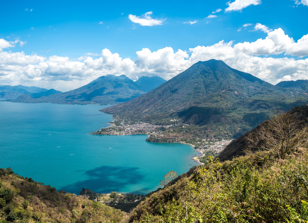 Viewpoint at lake Atitlan with the three volcanos San Pedro, Atitlan and Toliman - you can see the small villages San Pedro and San Juan at the lake in the highlands of Guatemala