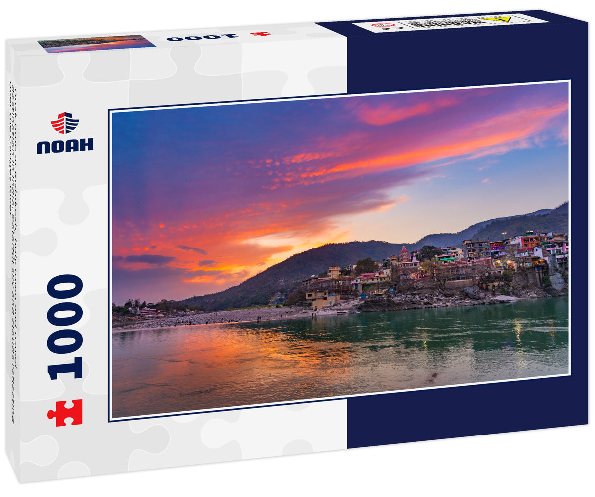 Dusk time at Rishikesh, holy town and travel destination in India. Colorful sky and clouds reflecting over the Ganges River