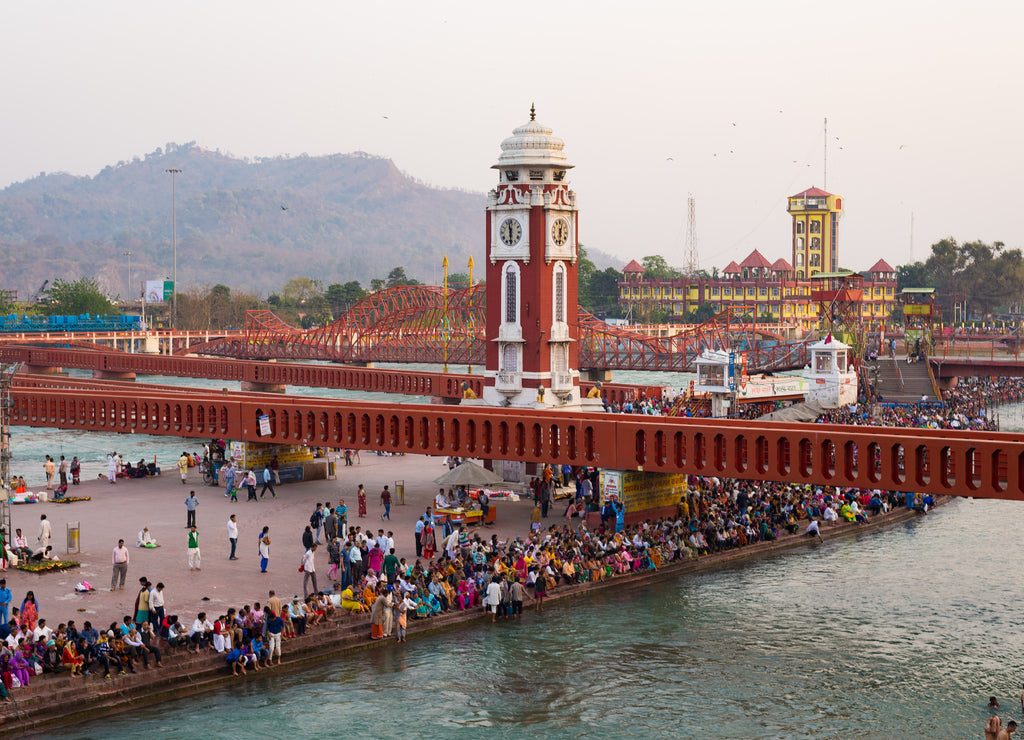 Holy ghats and temples at Haridwar, India, sacred town for Hindu religion. Pilgrims praying and bathing in the Ganges River