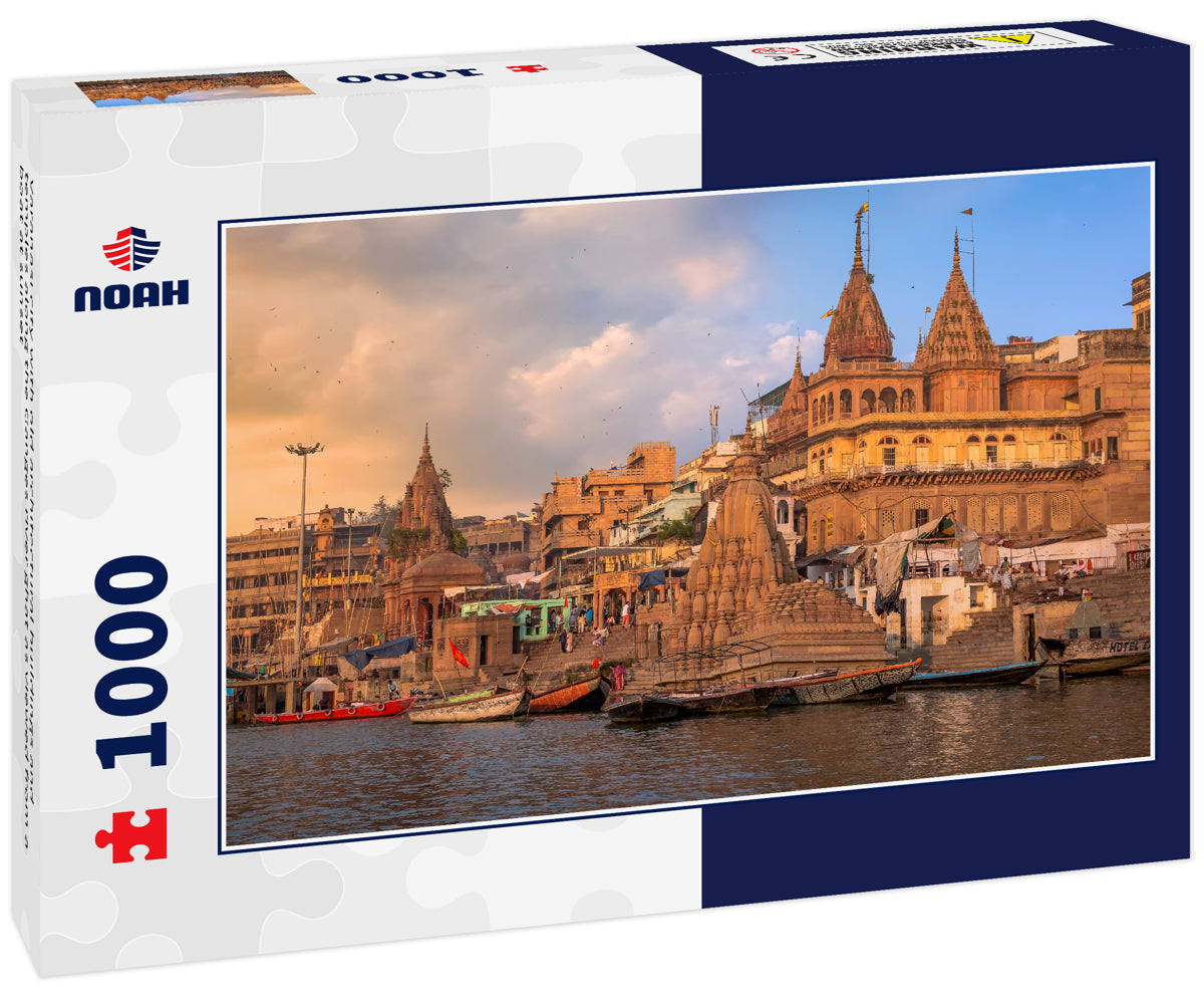 Varanasi city with old architectural buildings and temples along the Ganges river ghat as viewed from a boat at sunset