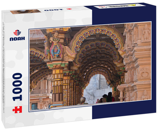 The brightly decorated Burmese teak archways in the a Hindu temple in Ahmedabad, India