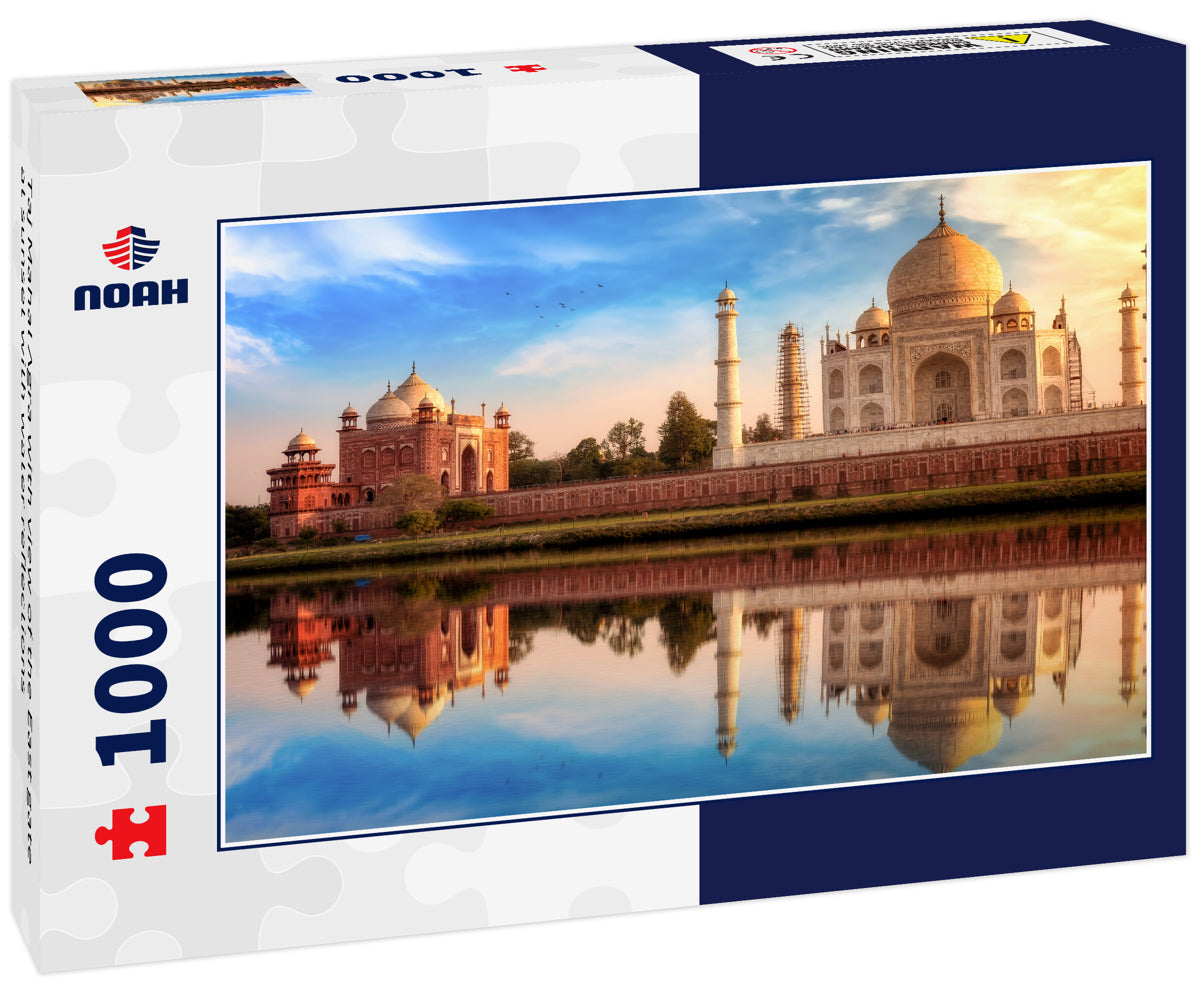 Taj Mahal Agra with view of the East gate at sunset with water reflections