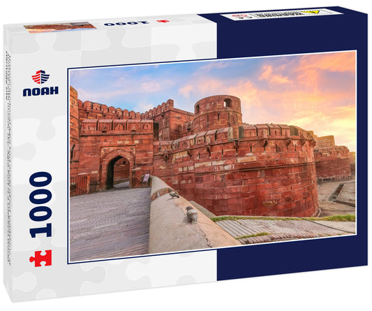 Historic medieval Agra Fort made of red sandstone at sunrise with moody sky. Agra Fort is a UNESCO World Heritage site