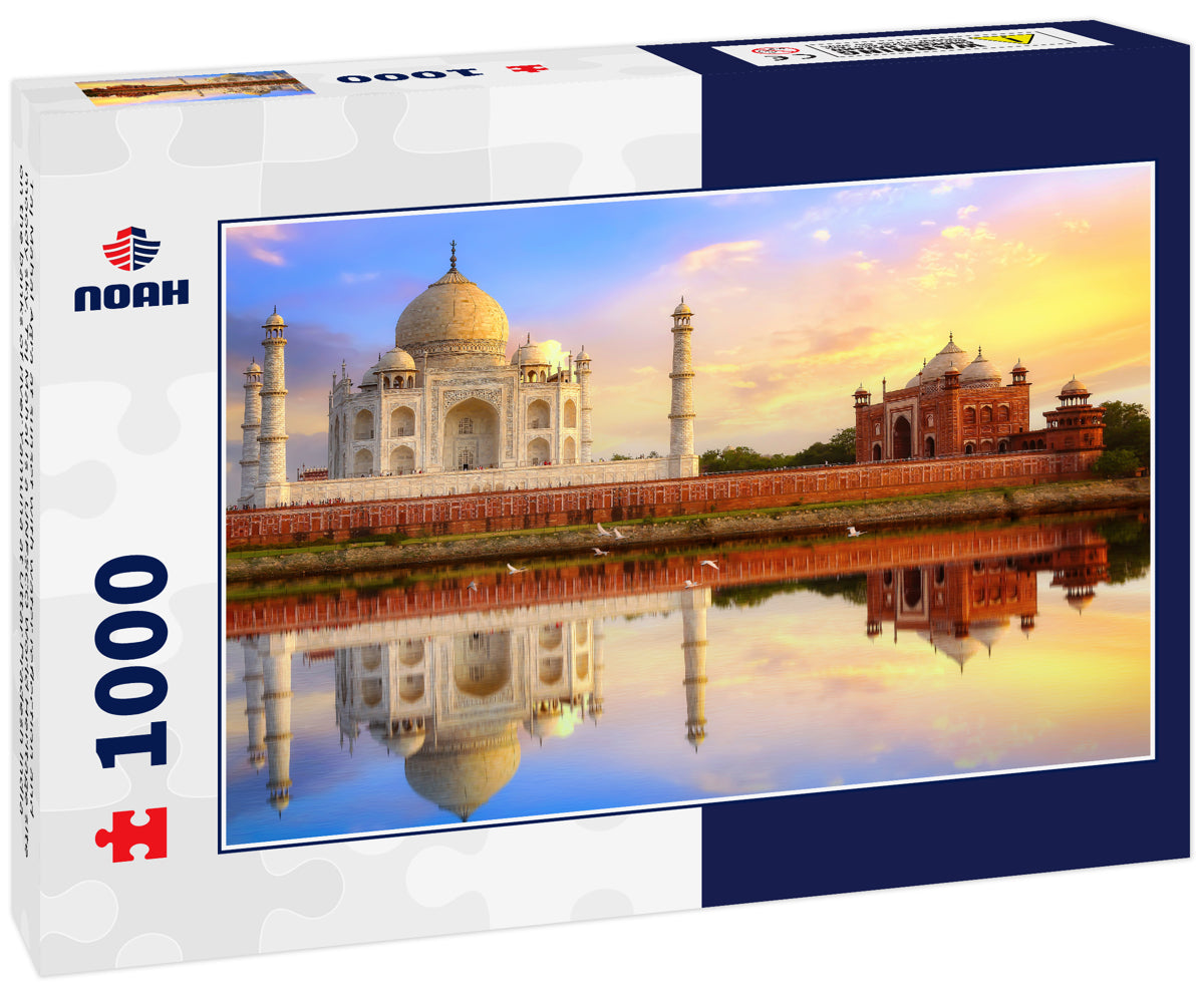 Taj Mahal Agra at sunset with water reflection and moody sky. Taj Mahal is a UNESCO World Heritage site on the banks of river Yamuna at Uttar Pradesh India