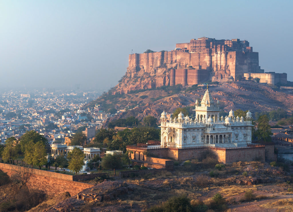 India, Jodhpur, city scape at sunset of Blue city and Mehrangarh Fort a UNESCO World Heritage Site with Jaswant Thada in the foreground