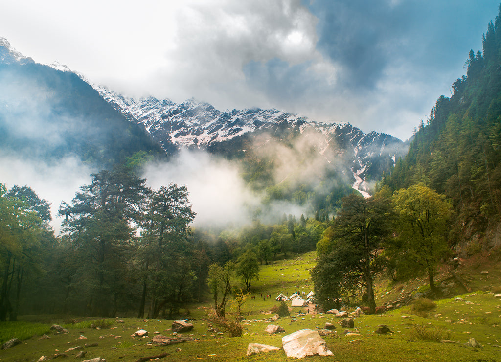 Landscape in the mountains. Hiking campsite in the scenic valley at the lap of Himalayan mountain forest, Himachal Pradesh India