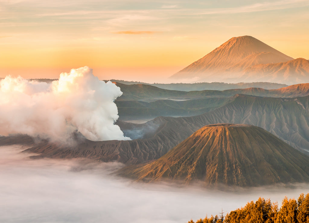 Landscape of Mount Bromo volcano, Batok and Semeru (Mt.) during sunrise from viewpoint on Mount Penanjakan located in Bromo Tengger Semeru National Park, East Java, Indonesia