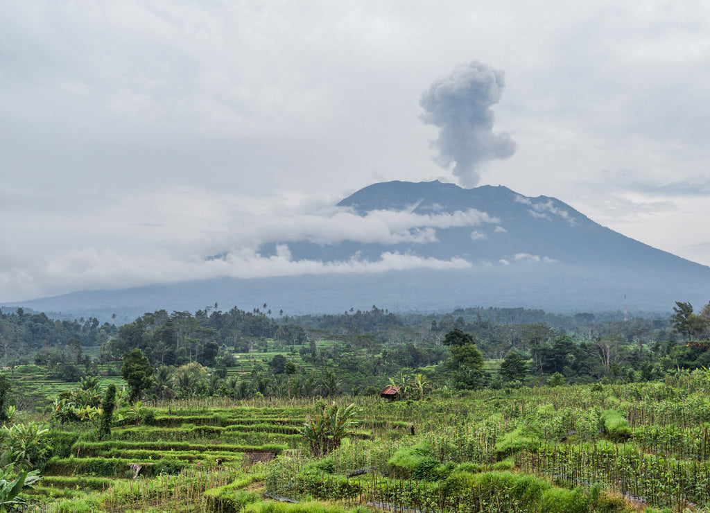 Agung volcano eruption view near rice fields, Bali, Indonesia