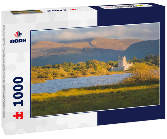 Golden hour sunset light on scenic mountain landscape of the historic medieval Ross Castle on Lough Leane lake in Killarney National Park, County Kerry, Ireland