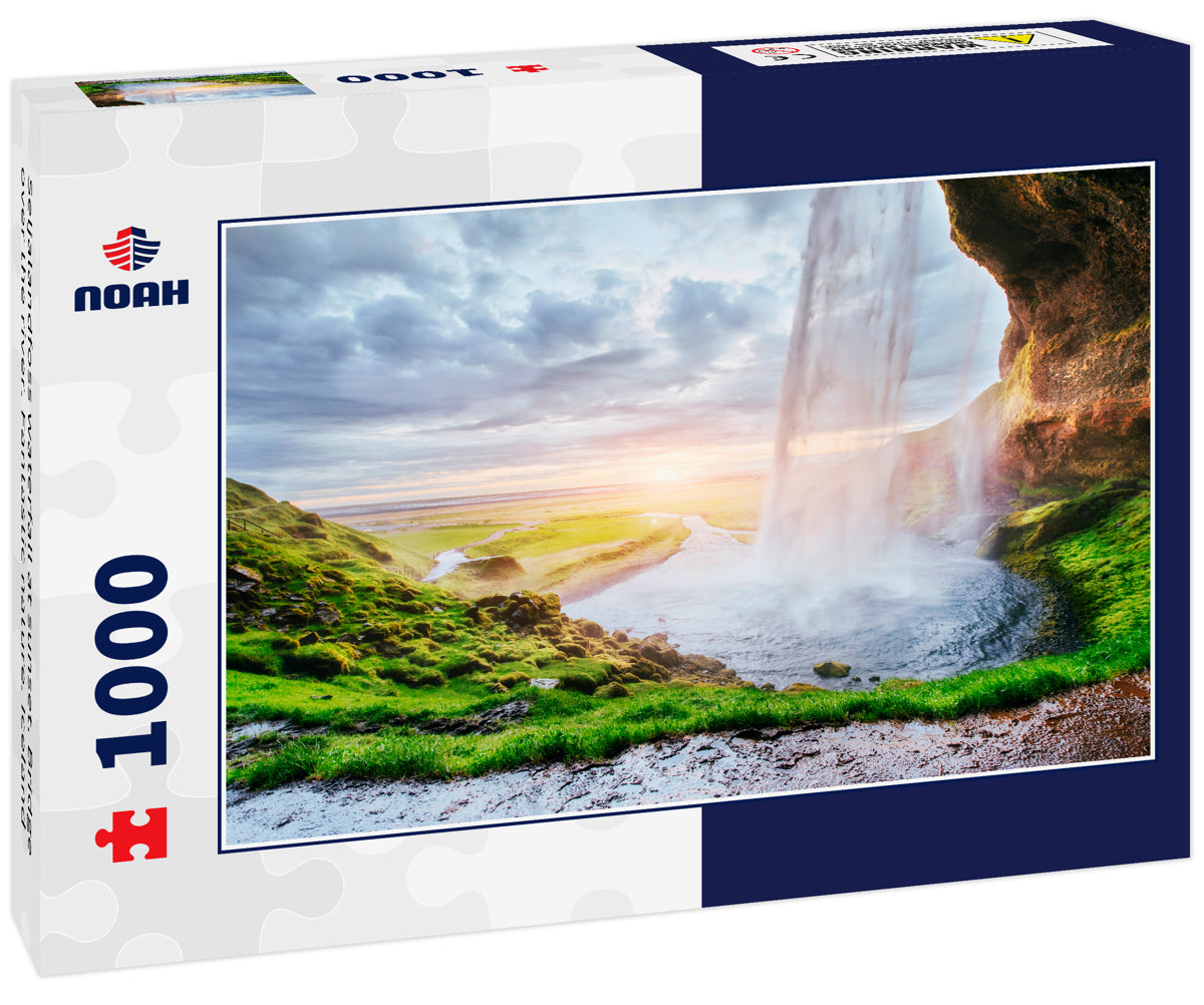 Seljalandfoss waterfall at sunset. Bridge over the river. Fantastic nature. Iceland