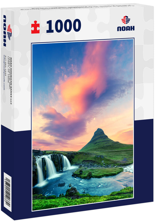 Colorful sunrise on Kirkjufellsfoss waterfall. Amazing morning scene near Kirkjufell volkano, Iceland