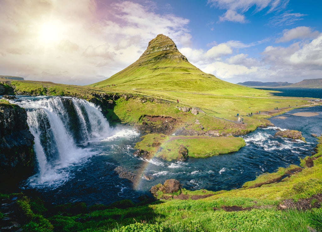 Breathtaking sunrise over Kirkjufell mountain landscape and waterfall in Iceland summer