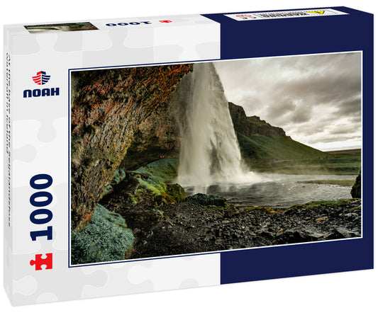 At the base of the Seljalandsfoss waterfall in Iceland