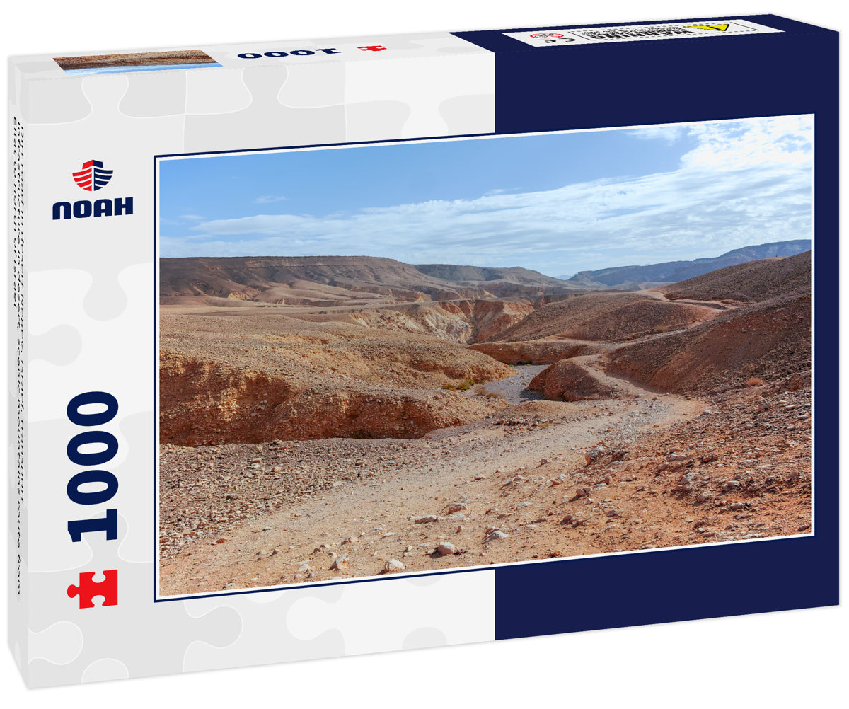 Dirt road in desert Negev, Israel, transport infrastructure in desert, scenic mountains route from Eilat to north of Israel