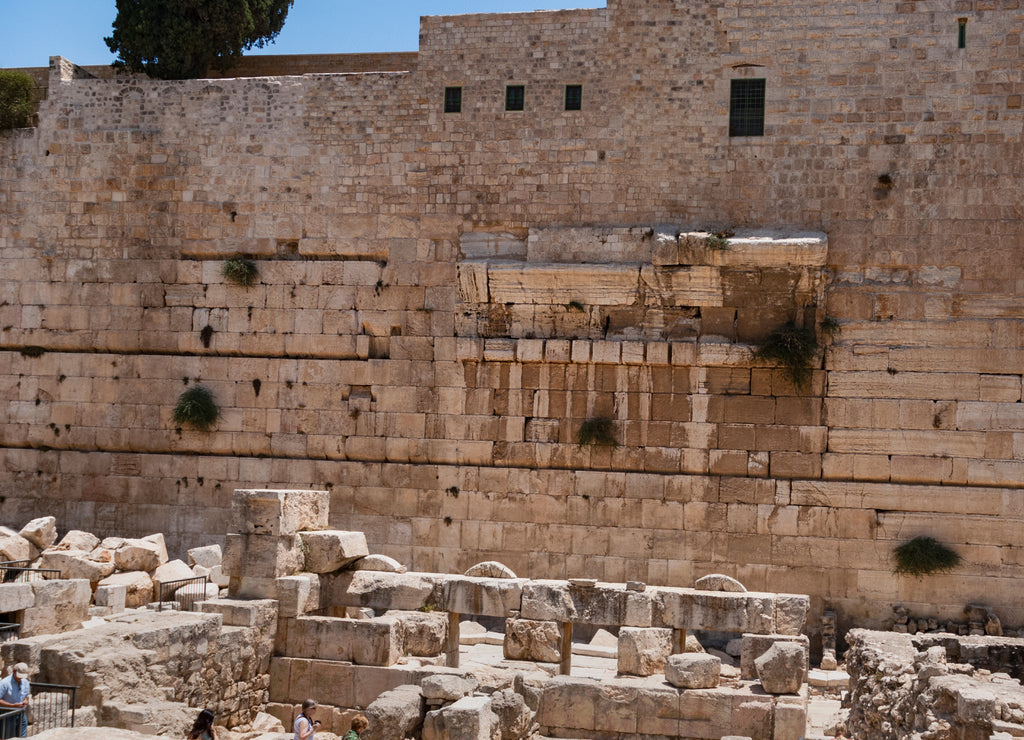 Remnants of Robinson's arch on the western wall above the Herodian Street below the temple mount in Jerusalem
