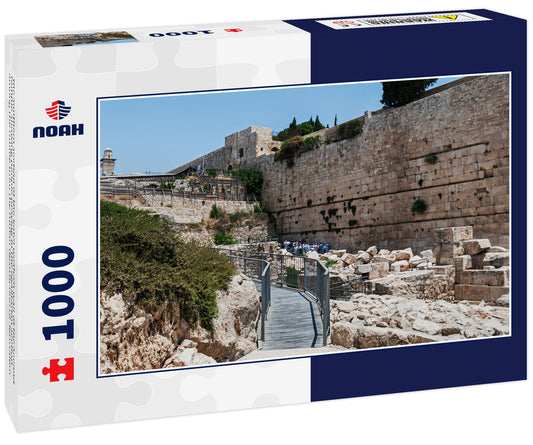 the southern section of the kotel western wall of the second temple showing people praying in the egalitarian section among the rubble from the roman destruction of Jerusalem