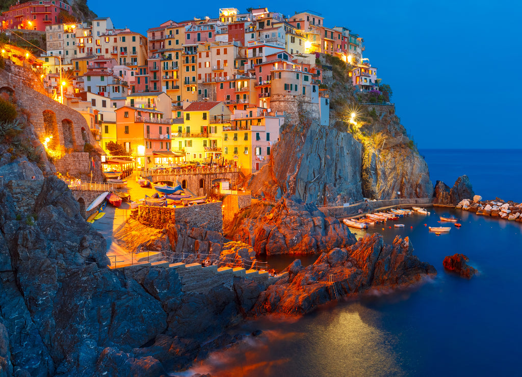 Aerial night view of Manarola fishing village, seascape in Five lands, Cinque Terre National Park, Liguria