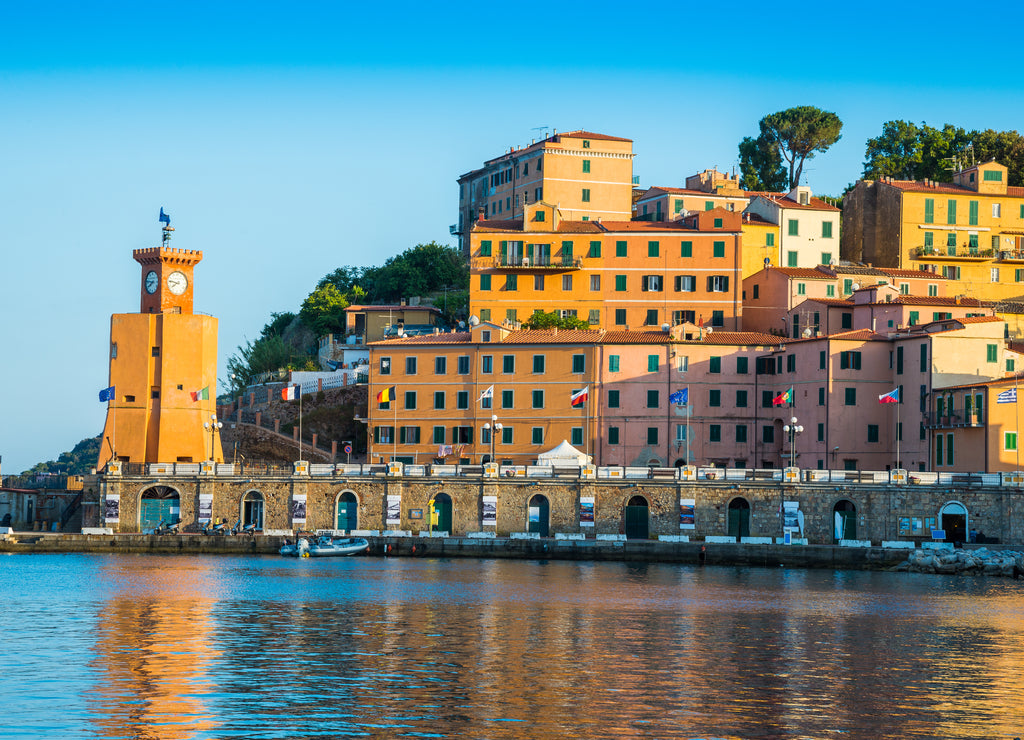 Sunset light illuminating the Lighthouse architecture of Rio Marina town - Elba island of Italy
