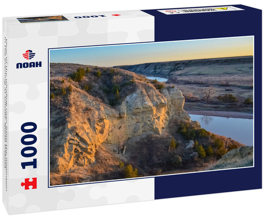 View of the winding river from the mountain in the evening at sunset. North Dakota