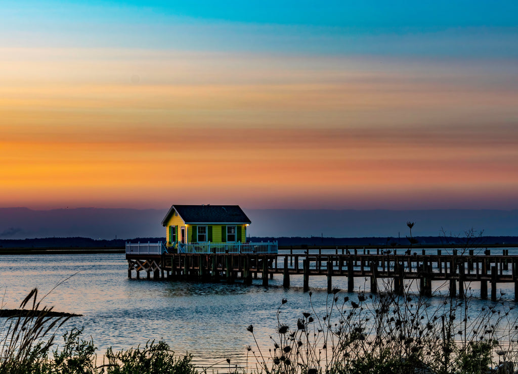 Sunset over fishing house in Chincoteague Bay Virginia