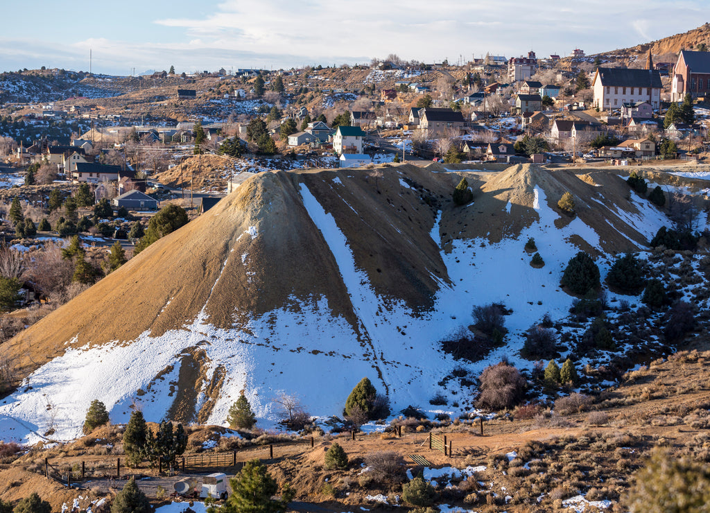 Snow covered tailing pile on the edge of historic Virginia City nevada