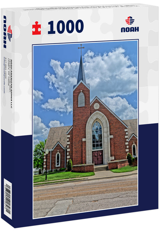 Vertical shot of a church at Cole Camp, Missouri with a cloudy blue sky in the background