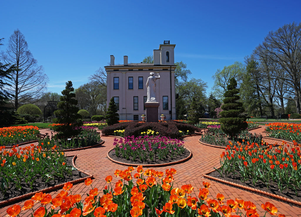 Green park with arrangement of colorful flowers and structure buildings at Saint Louis town Missouri, United States