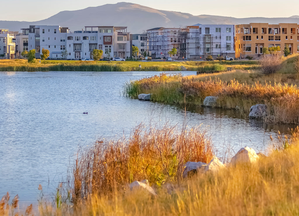 Lakeside view with homes and mountain in Utah